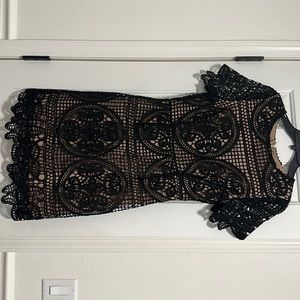 Black and nude lace midi dress.